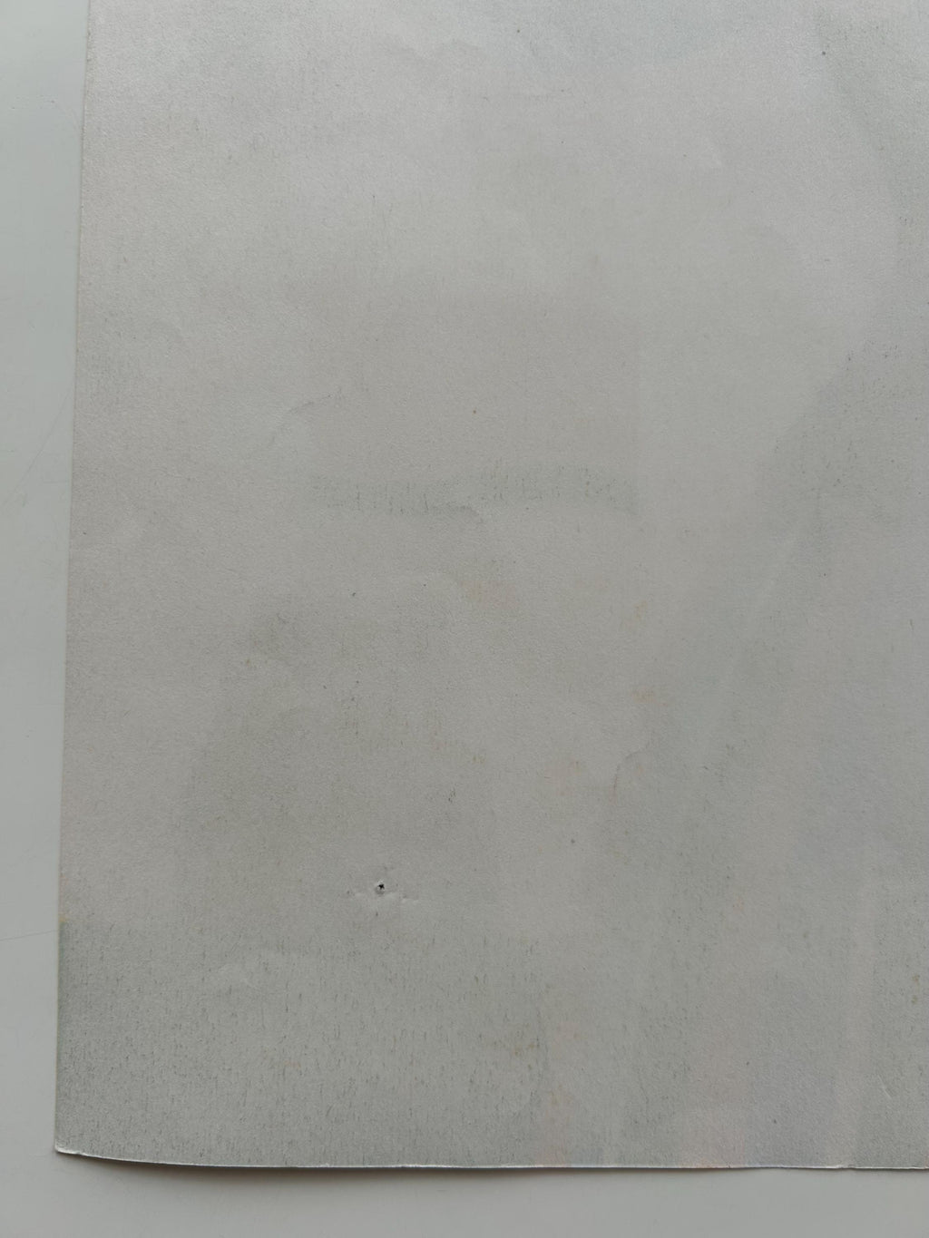 Plain gray sheet of paper on a white background