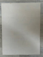 Plain white sheet of paper on a wooden surface
