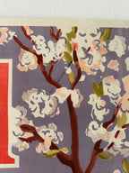 Decorative paper with floral branch design on a purple background