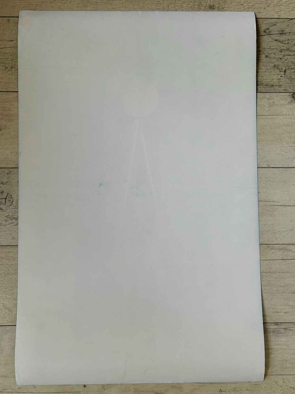 White sheet of paper on a wooden surface