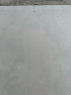 Close-up of a gray concrete surface with a visible crack.