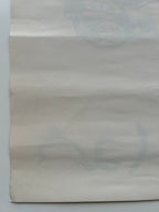 Plain beige paper on a light gray background