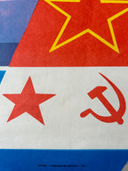 Close-up of a Soviet flag with red star and hammer-sickle symbol on a white background