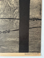 Textured surface with a central black strip and text on a white background