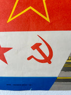 Flag with hammer and sickle symbol and red star on a red, white, and blue background.