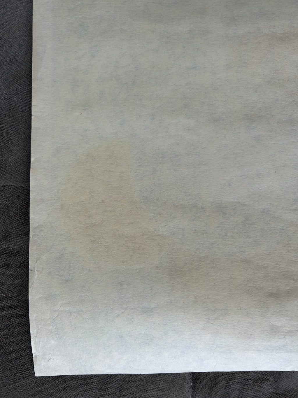Sheet of white paper on a black background