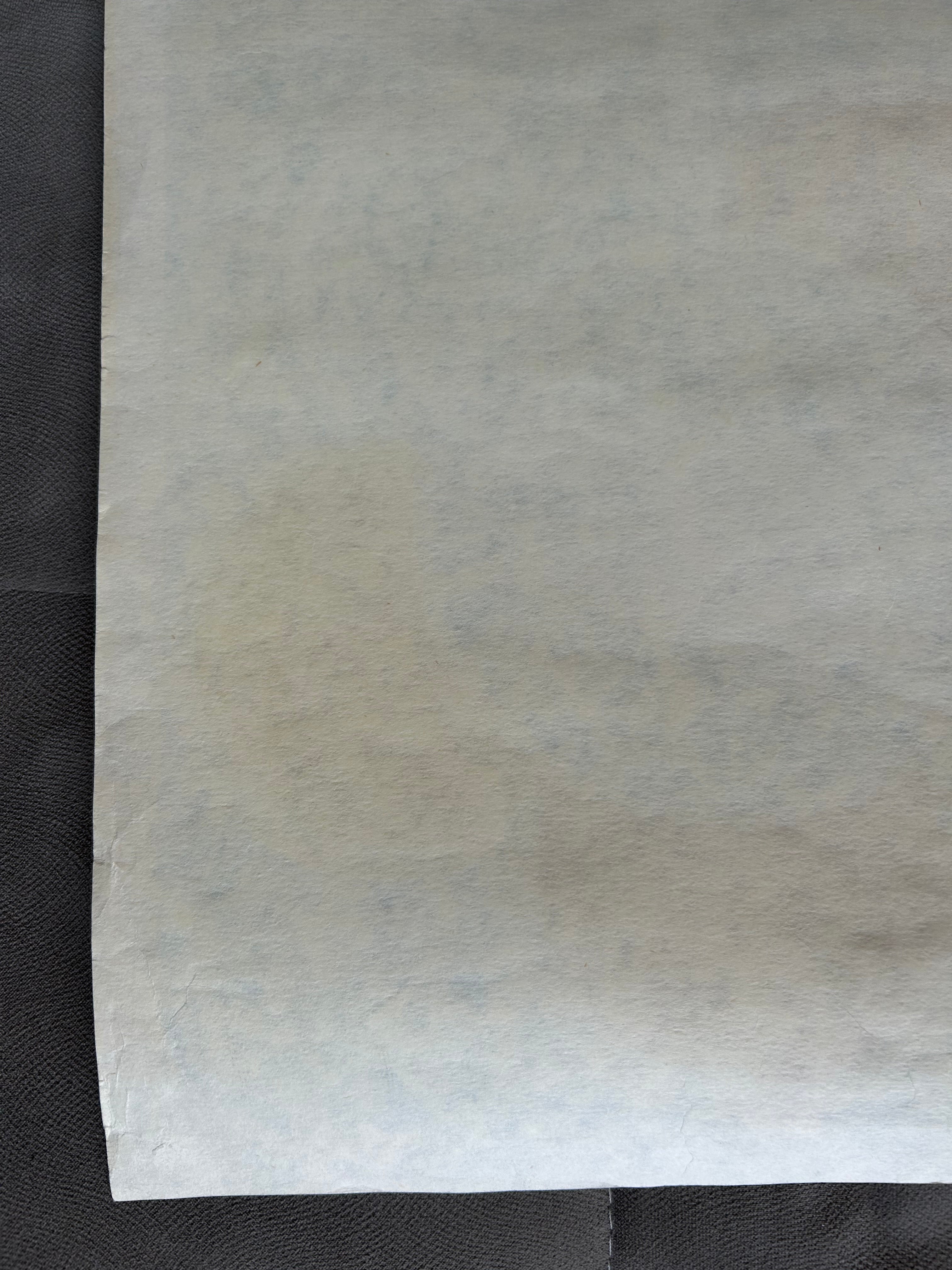 Sheet of white paper on a black background