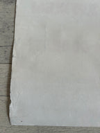 White paper sheet on a wooden surface