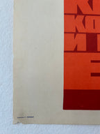 Abstract art print with geometric shapes on a red background, signed by the artist.