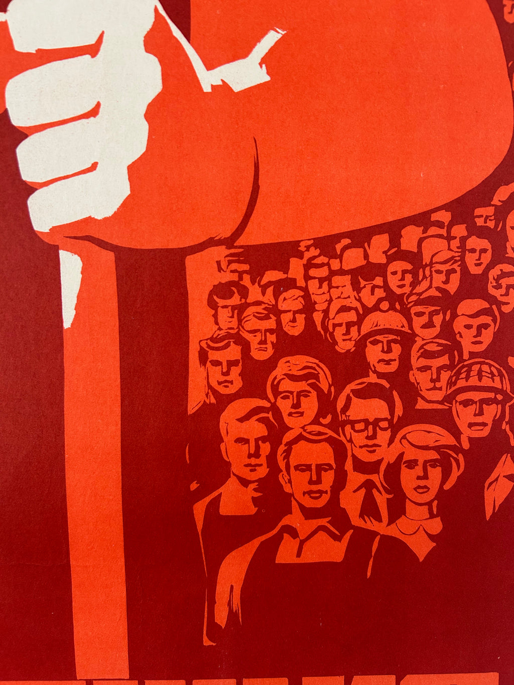 Surreal artwork with a large hand, surrounded by multiple faces on a red background.