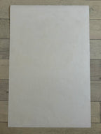 White sheet of paper on a wooden surface