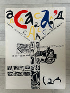 Artistic poster with abstract designs and text on a wooden surface