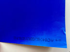 Blue sheet of paper with text on a white background