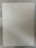 Plain white sheet on a textured gray background