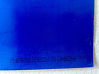 Blue plastic sheet with text on a white background
