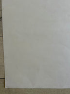 Plain white sheet of paper on a wooden surface
