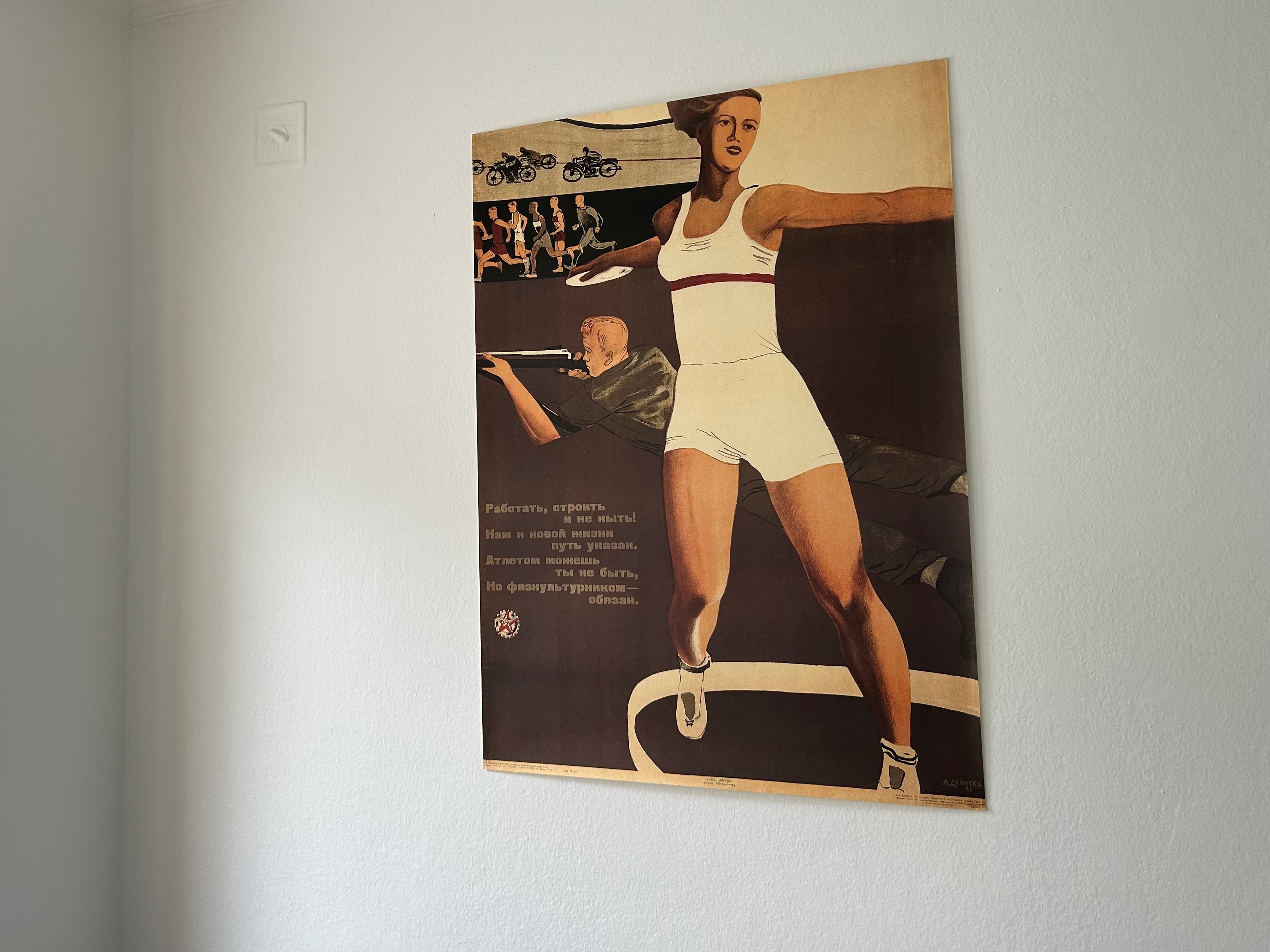 Vintage-style poster of a woman in athletic wear on a plain wall.