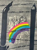 Collage with rainbow and vintage-style illustration of people in hats.