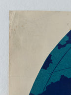 Partial view of a blue and beige paper with a textured background