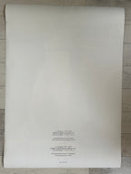 White paper with text on a wooden surface