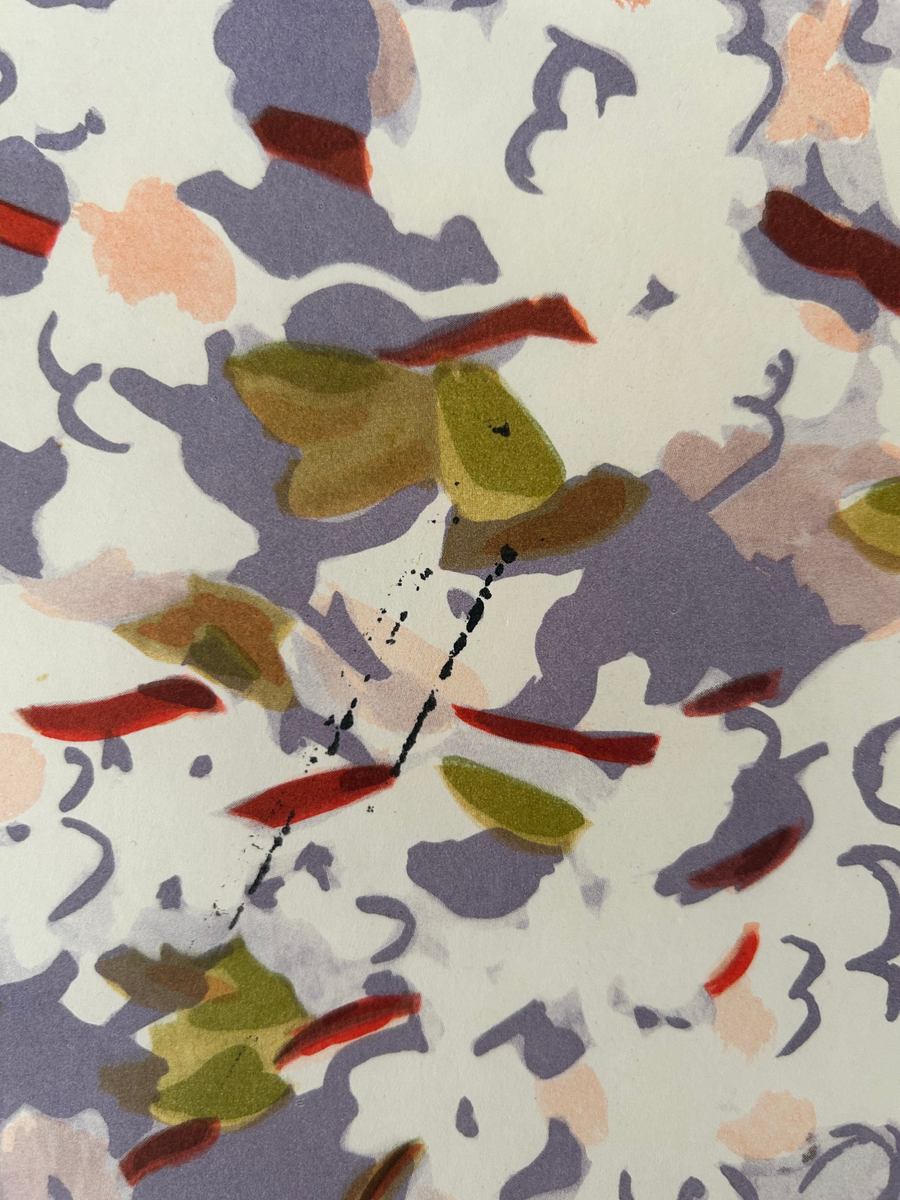 Close-up of a pattern with green, brown, and red colors on a white background.