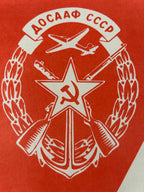 Soviet coat of arms with star, hammer, and sickle on a red background
