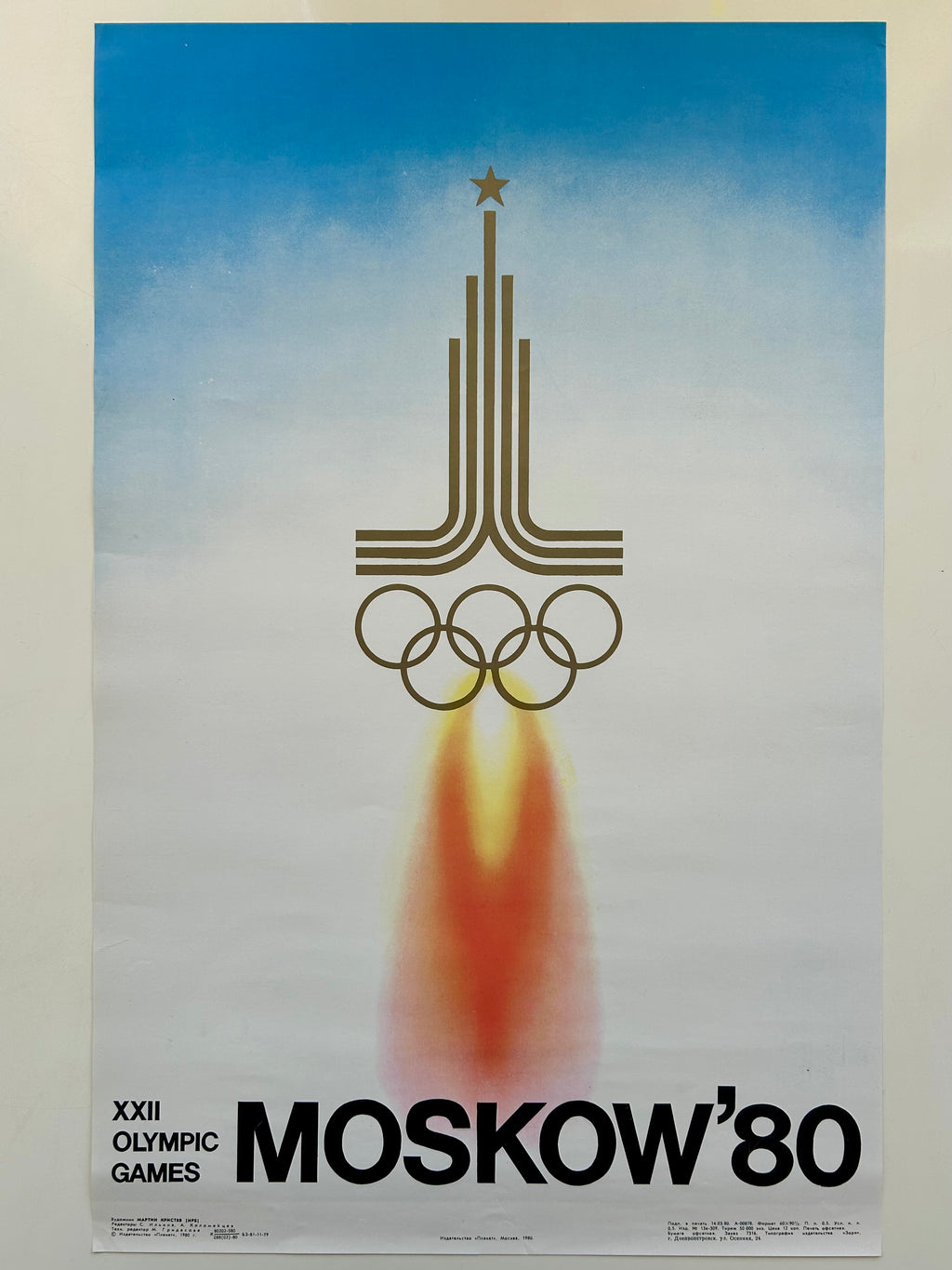 unframed poster of the 1980 Moscow Olympics with a rocket and Olympic rings design.