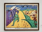 Framed artwork by K.S. Malevich's artwork 'Wilhelm Carousel' with a colorful landscape and figures on a white wall.