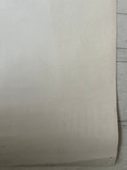 Beige paper on a wooden surface