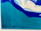 Abstract artwork with blue and white shapes on a textured surface