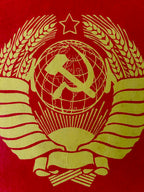 USSR Coat of arms with hammer and sickle on a red background