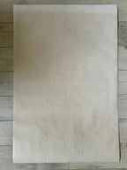 Rectangular piece of  paper on a wooden surface
