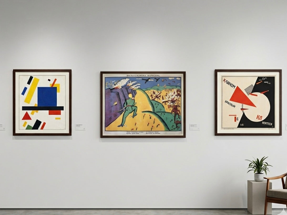 Three abstract artworks on a wall in an art gallery setting.