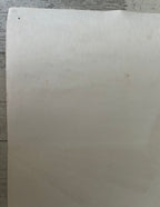 White sheet of paper on a wooden surface