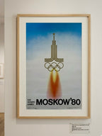 Framed poster of the 1980 Moscow Olympics with a rocket and Olympic rings design.