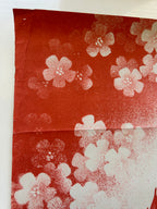 Red and white floral patterns on a white background
