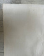 White sheet of paper on a wooden surface