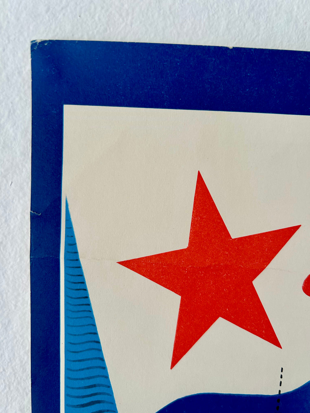 Close-up of a red star on a blue and white background