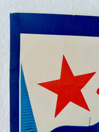 Close-up of a red star on a blue and white background