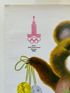 Vintage poster featuring a bear with Olympic medals and a logo, likely related to the 1980 Moscow Olympics.