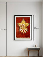 Framed military poster with a star design on a white wall, showing dimensions.
