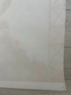White paper with a subtle pattern on a wooden surface