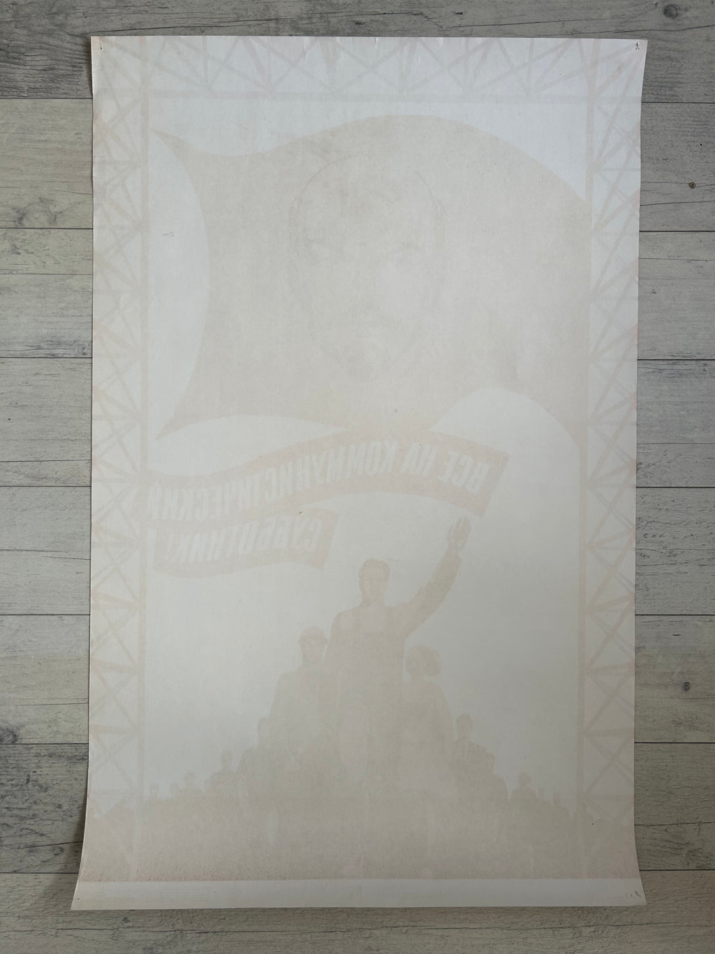 White textured paper with a printed design of a person holding a flag on a wooden surface