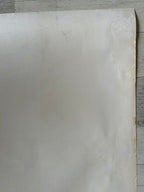 Sheet of white paper on a wooden surface