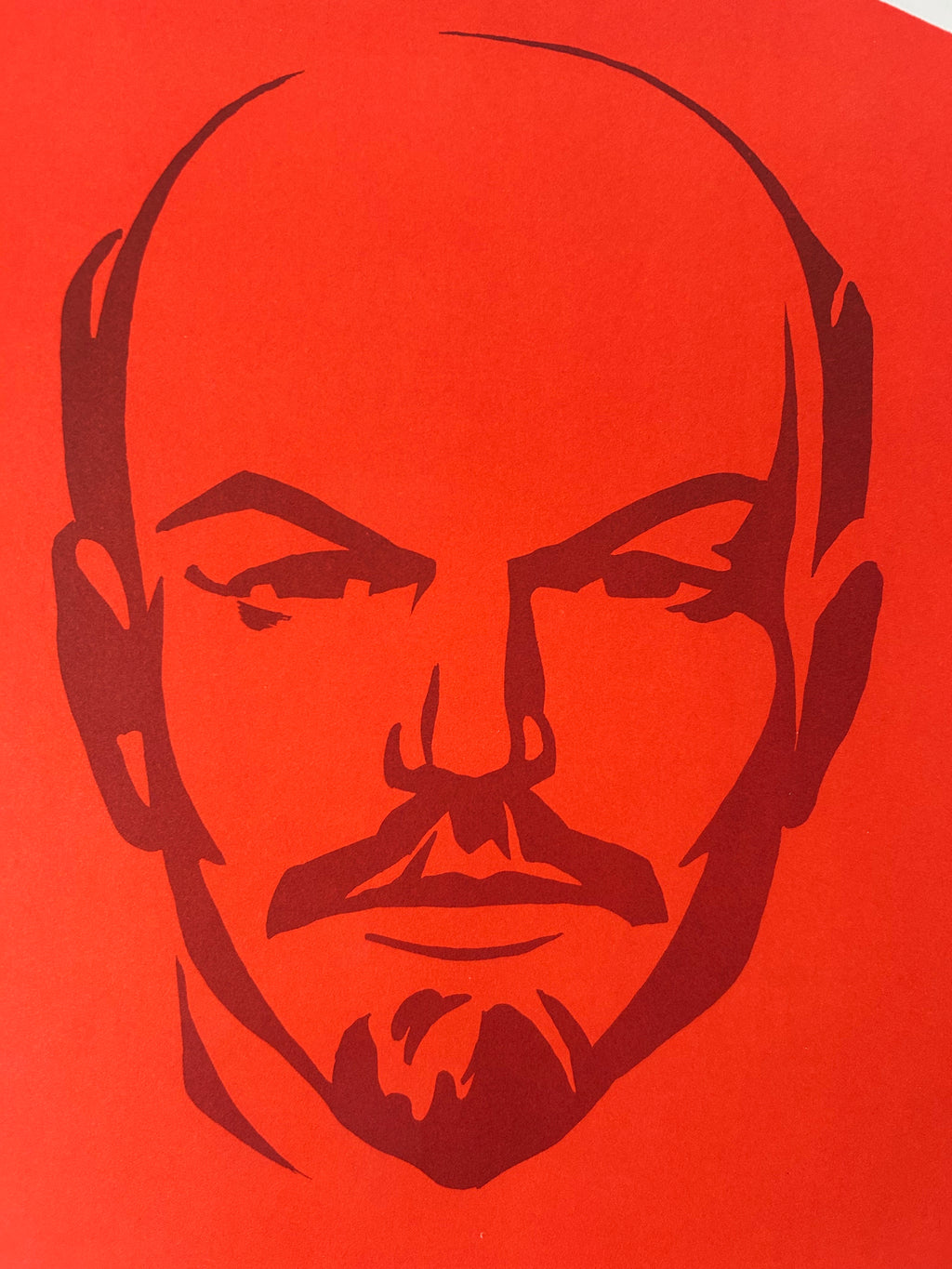 Stylized portrait of communist leader, Vladimir Lenin,  on a red background