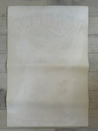 Sheet of white  paper on a wooden surface