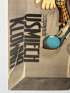 Poster with text 'USMECH KLONO' and a shoe stepping on a blue ball, on a textured beige background.