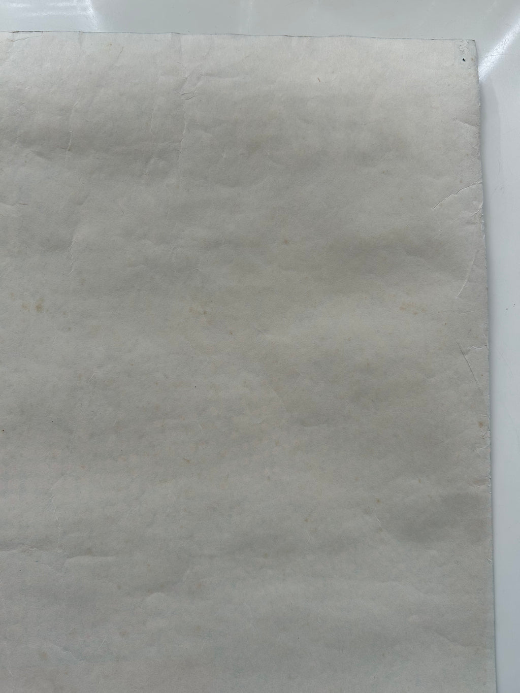 Close-up of a textured beige fabric sheet