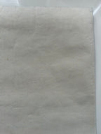 Close-up of a textured beige fabric sheet