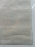 Gray textured paper on a white background